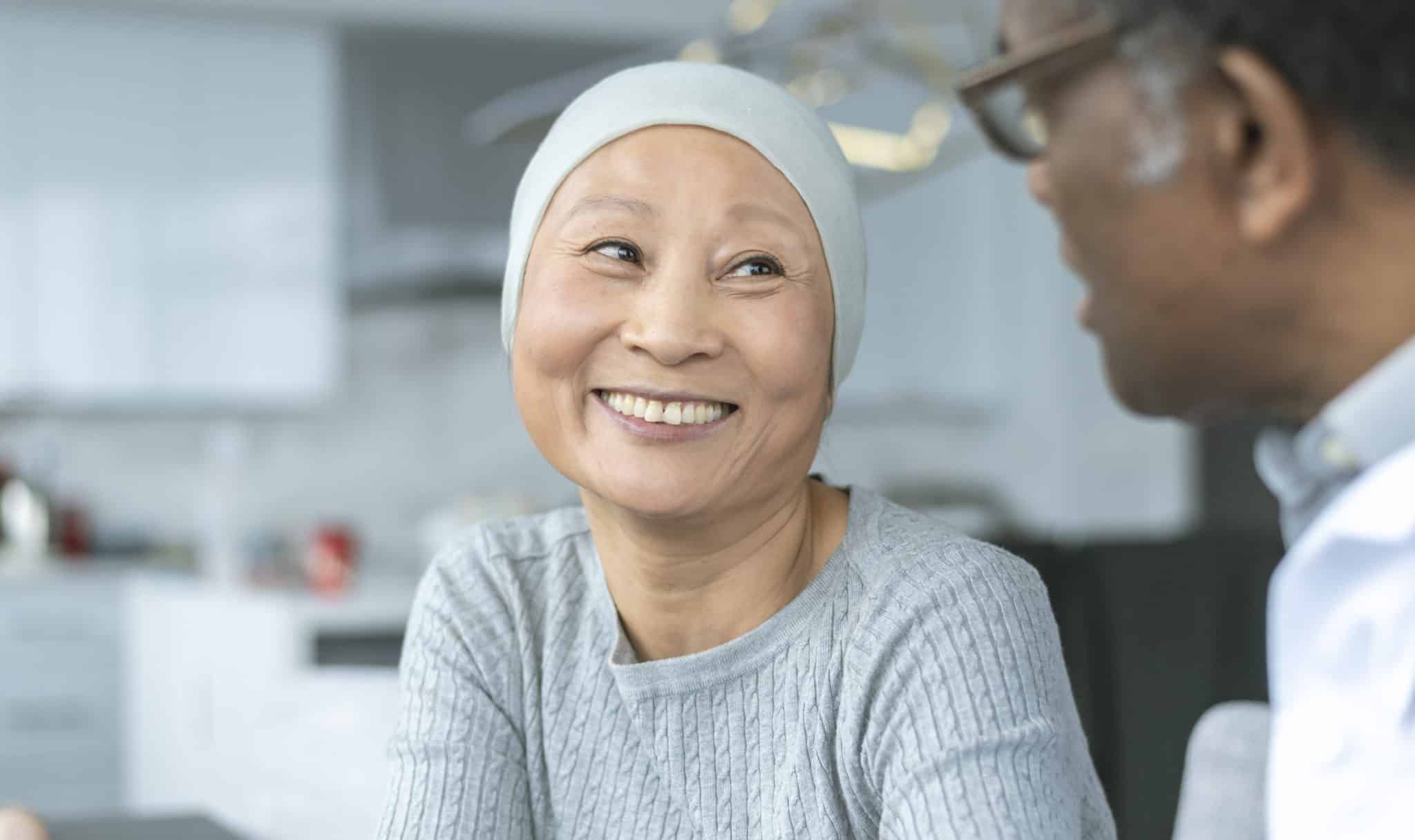 An outpatient chemo patient speaks with a doctor