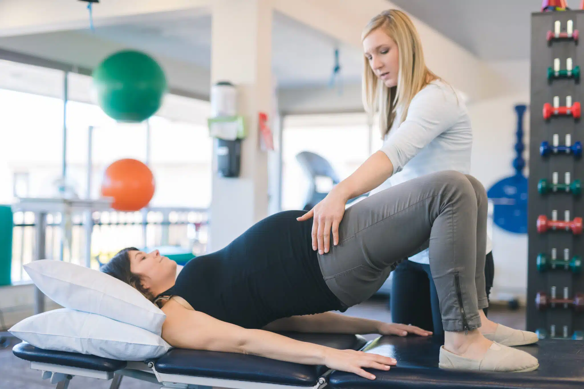 Physical therapist and female patient